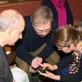 Isobel does something on a phone, Sylvia's 70th Birthday up the Swan Inn, Brome, Suffolk - 11th February 2017