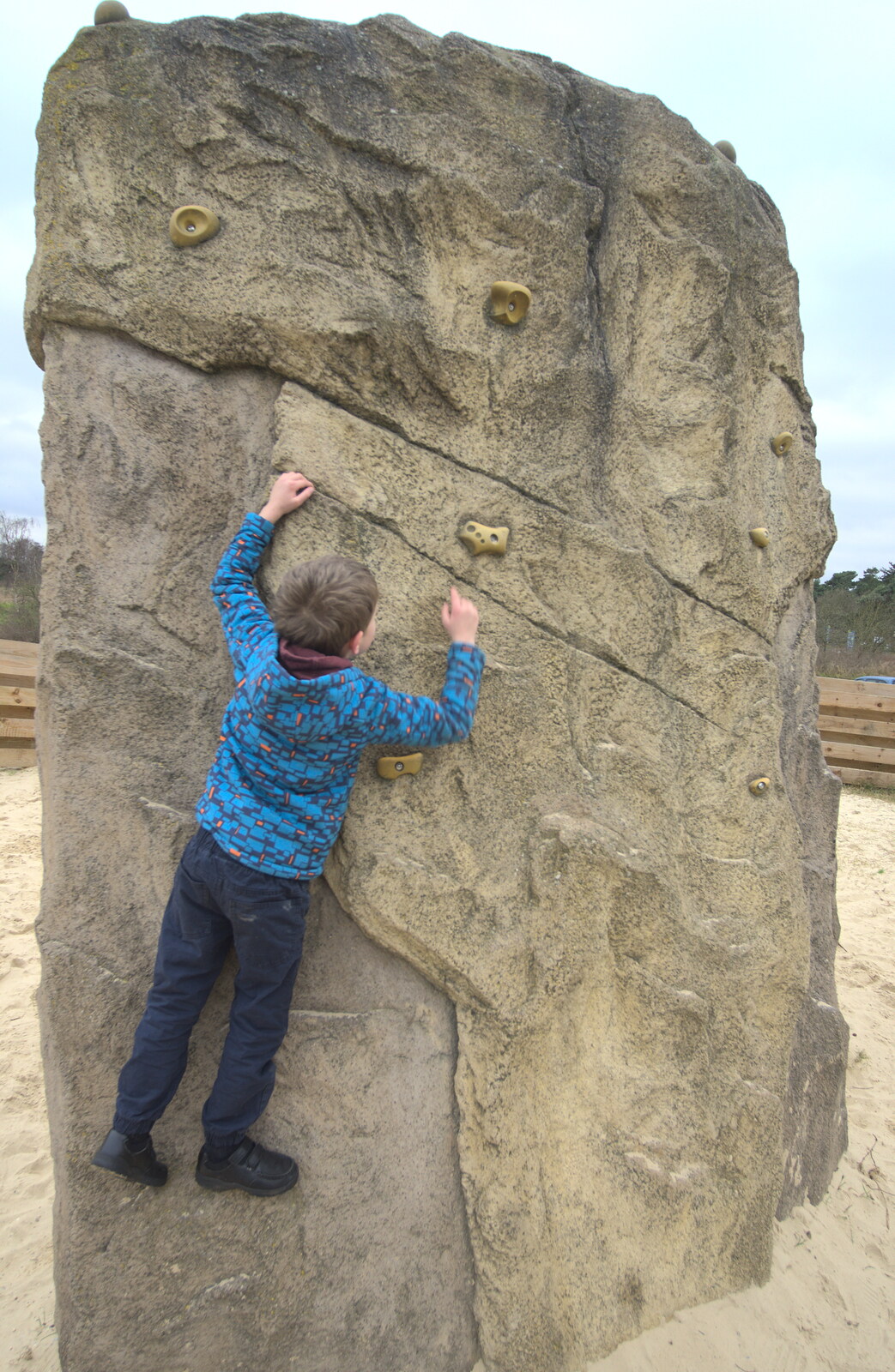 Fred clings to a climbing wall from An Anglo-Saxon Village, West Stow, Suffolk - 19th February 2017