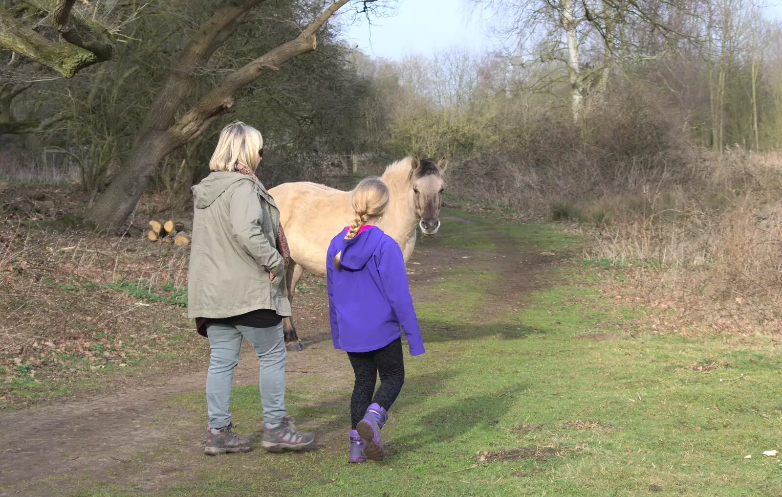 Rachel and Anna pass a pony, from Redgrave and Lopham Fen, Suffolk Border - 11th March 2017