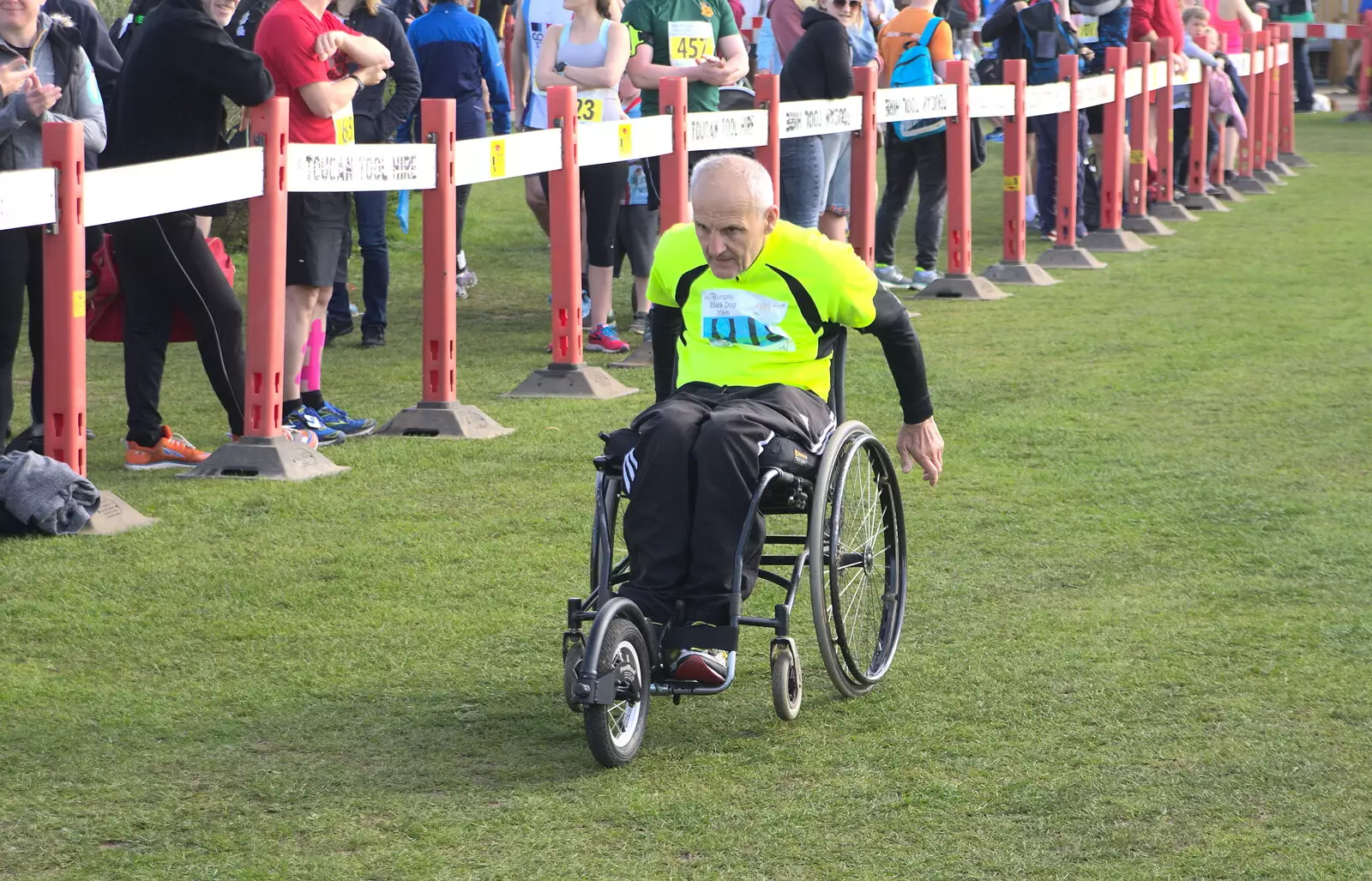 A dude with a wheelchair finishes, from The Black Dog Festival of Running, Bungay, Suffolk - 2nd April 2017