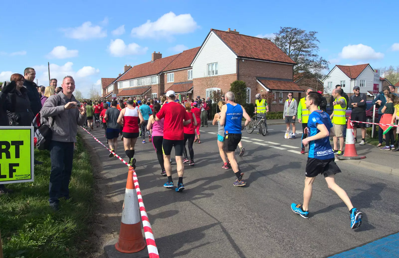 Runners head off up the road, from The Black Dog Festival of Running, Bungay, Suffolk - 2nd April 2017