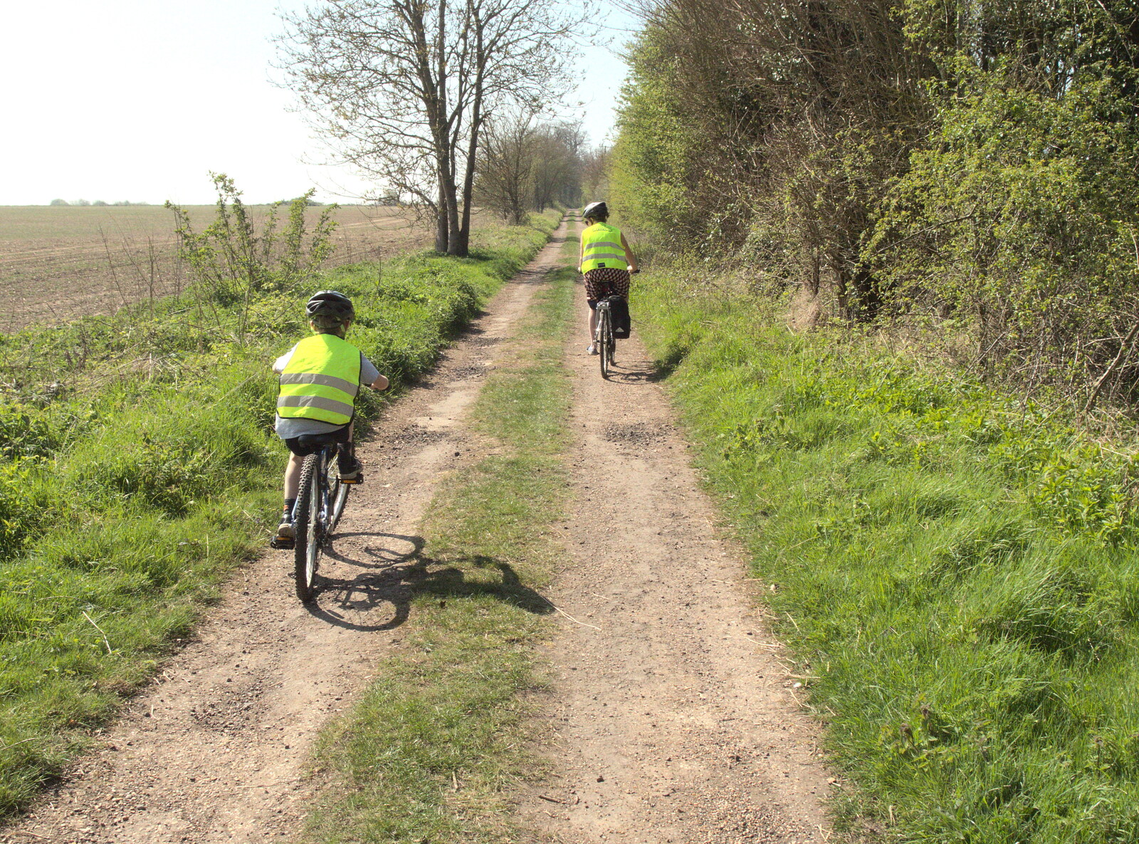 Fred and Isobel cycle up Brome Avenue from Cycling to Bigod's Castle, Eye, Suffolk - 9th April 2017