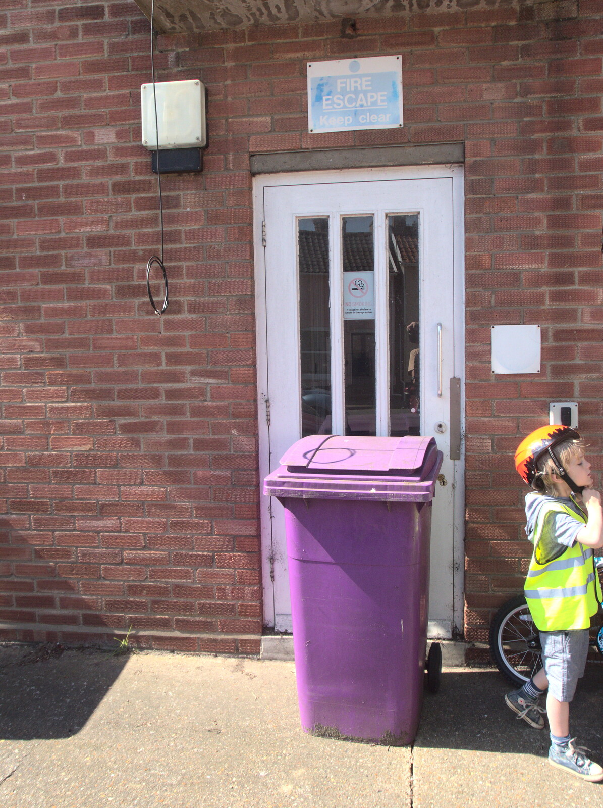 A purple wheelie bin in front of a fire escape from Cycling to Bigod's Castle, Eye, Suffolk - 9th April 2017