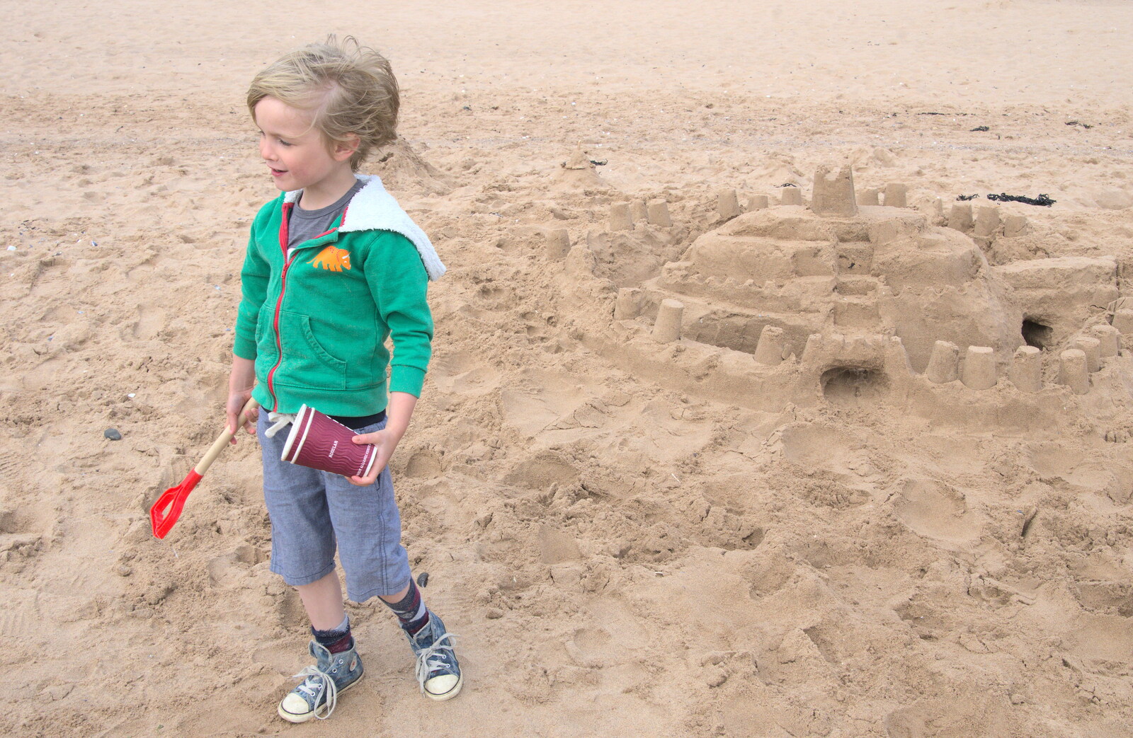 Harry by the sand castle from Grandma J's and a Day on the Beach, Spreyton and Exmouth, Devon - 13th April 2017