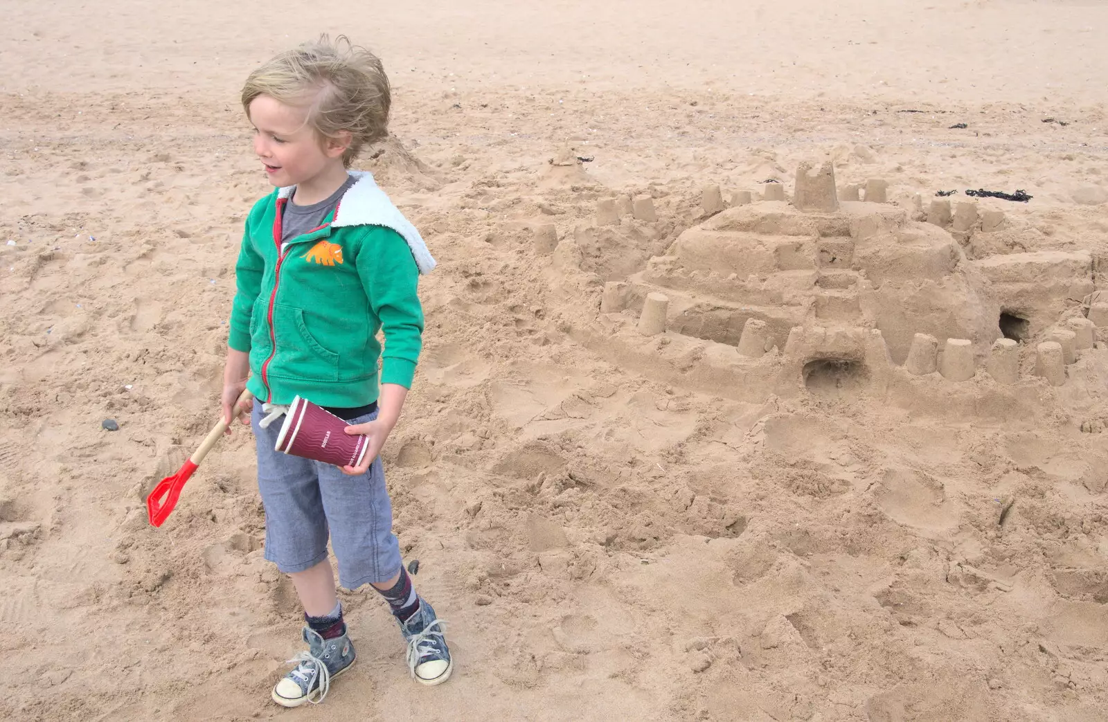 Harry by the sand castle, from Grandma J's and a Day on the Beach, Spreyton and Exmouth, Devon - 13th April 2017