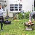 Isobel watches as stuff is set on fire, A Barbeque, Grimspound and Pizza, Dartmoor and Exeter, Devon - 15th April 2017