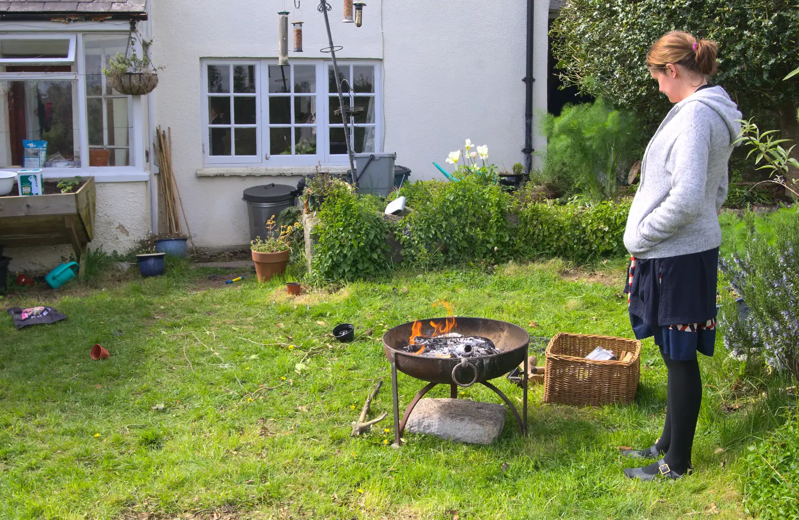 Isobel watches the fire, from A Barbeque, Grimspound and Pizza, Dartmoor and Exeter, Devon - 15th April 2017