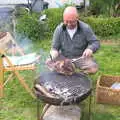 Matt sticks a massive lump of lamb on the fire, A Barbeque, Grimspound and Pizza, Dartmoor and Exeter, Devon - 15th April 2017