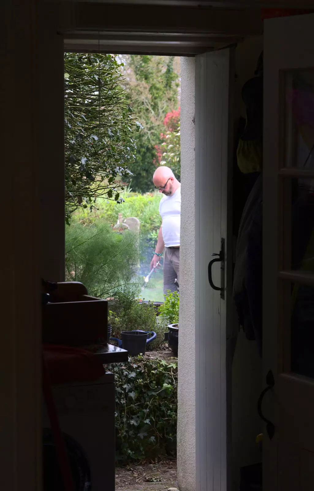 Matt pokes the fire, from A Barbeque, Grimspound and Pizza, Dartmoor and Exeter, Devon - 15th April 2017