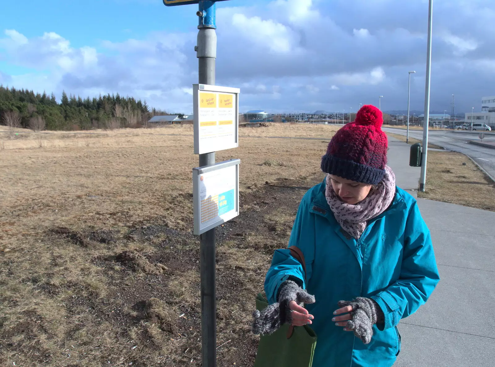 Isobel waits at the bus-stop near the hotel, from A Trip to Reykjavik, Iceland - 20th April 2017