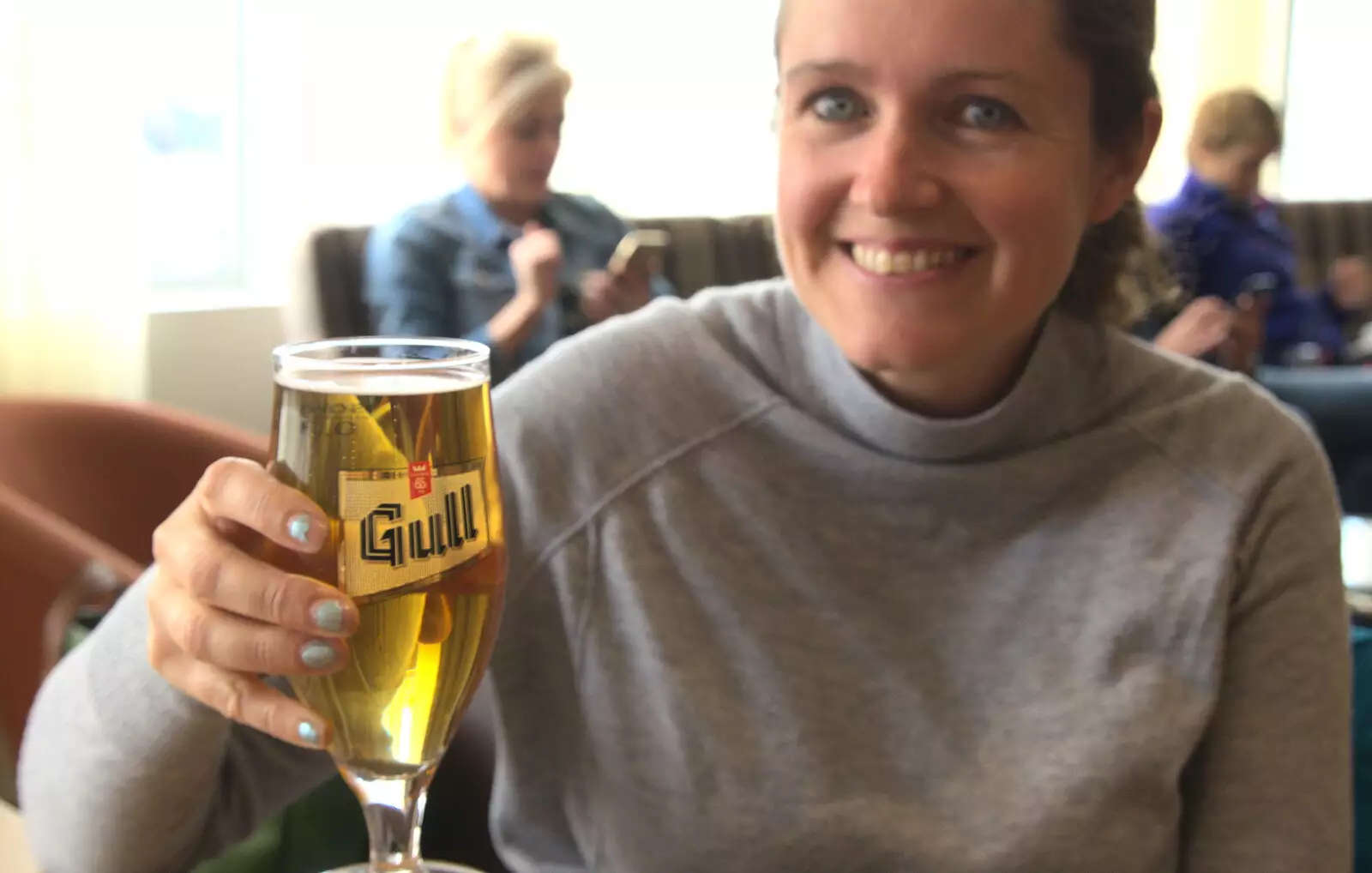 Isobel holds up an £8 glass of beer, from A Trip to Reykjavik, Iceland - 20th April 2017