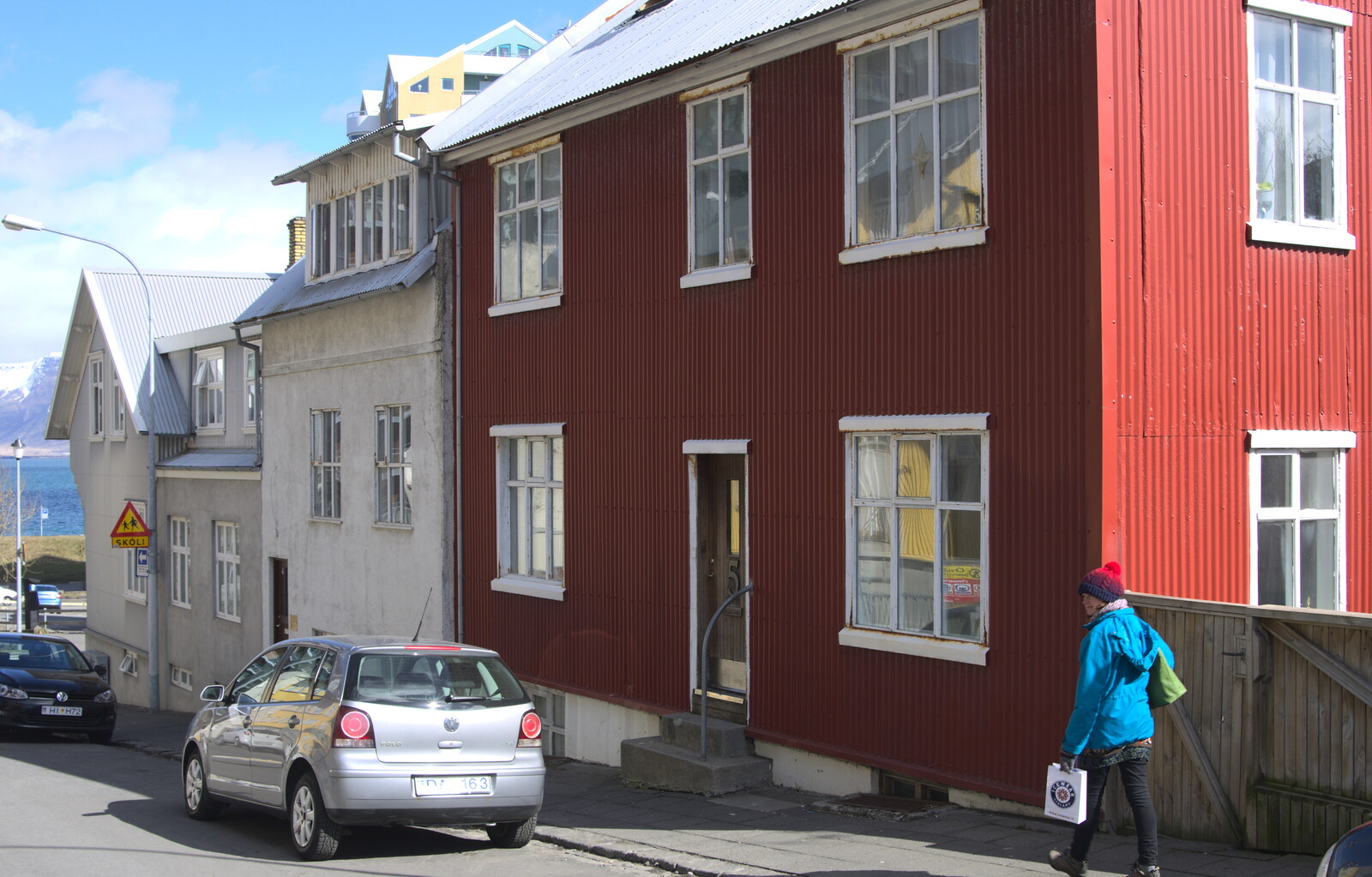 Isobel walks past a red corrugated house from Stríðsminjar War Relics, Perlan and Street Art, Reykjavik, Iceland - 23rd April 2017