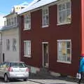 Isobel walks past a red corrugated house, Stríðsminjar War Relics, Perlan and Street Art, Reykjavik, Iceland - 23rd April 2017