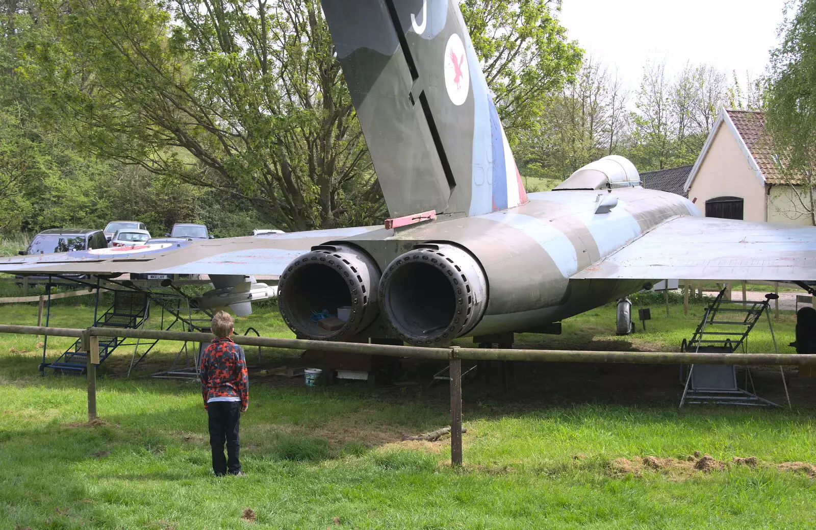 Fred stares up an aircraft tail pipe, from Norfolk and Suffolk Aviation Museum, Flixton, Suffolk - 30th April 2017