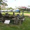 Isobel looks at a pile of wreckage, Norfolk and Suffolk Aviation Museum, Flixton, Suffolk - 30th April 2017