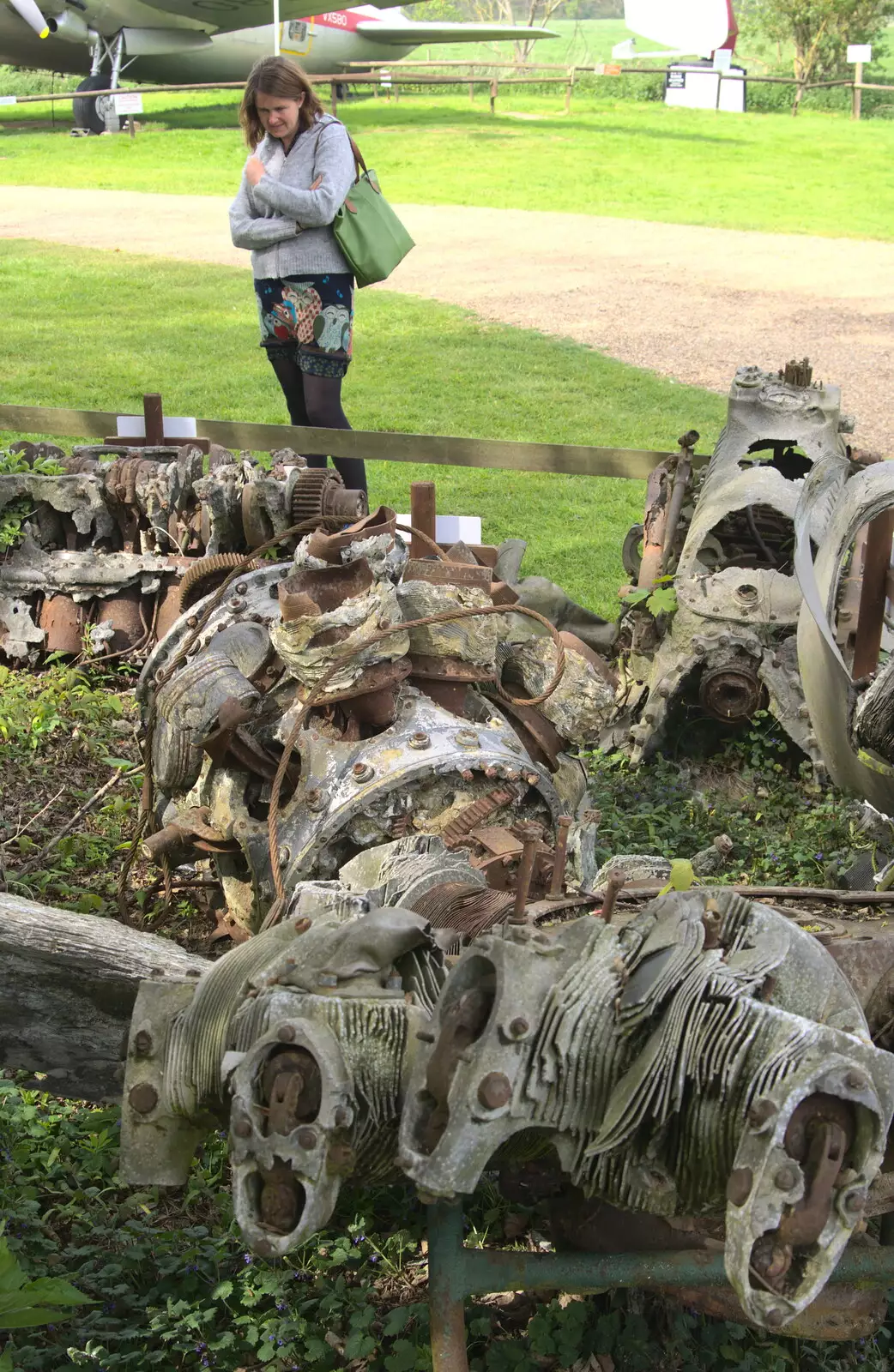 Isobel looks at mangled engines, from Norfolk and Suffolk Aviation Museum, Flixton, Suffolk - 30th April 2017