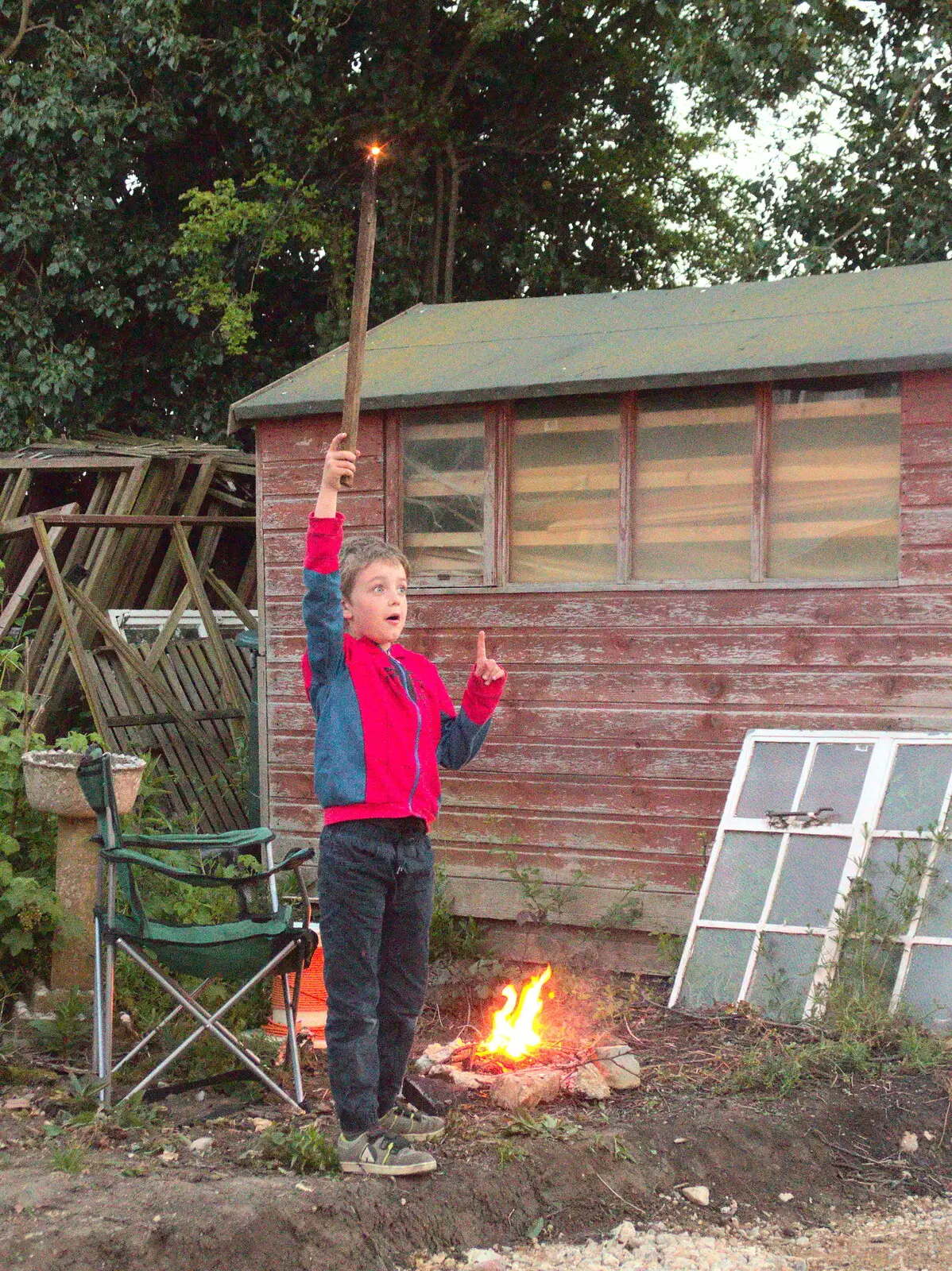 Fred waves a burning stick in the air, from Campfires, Oaksmere Building and a BSCC Bike Ride, Brome, Suffolk - 4th May 2017