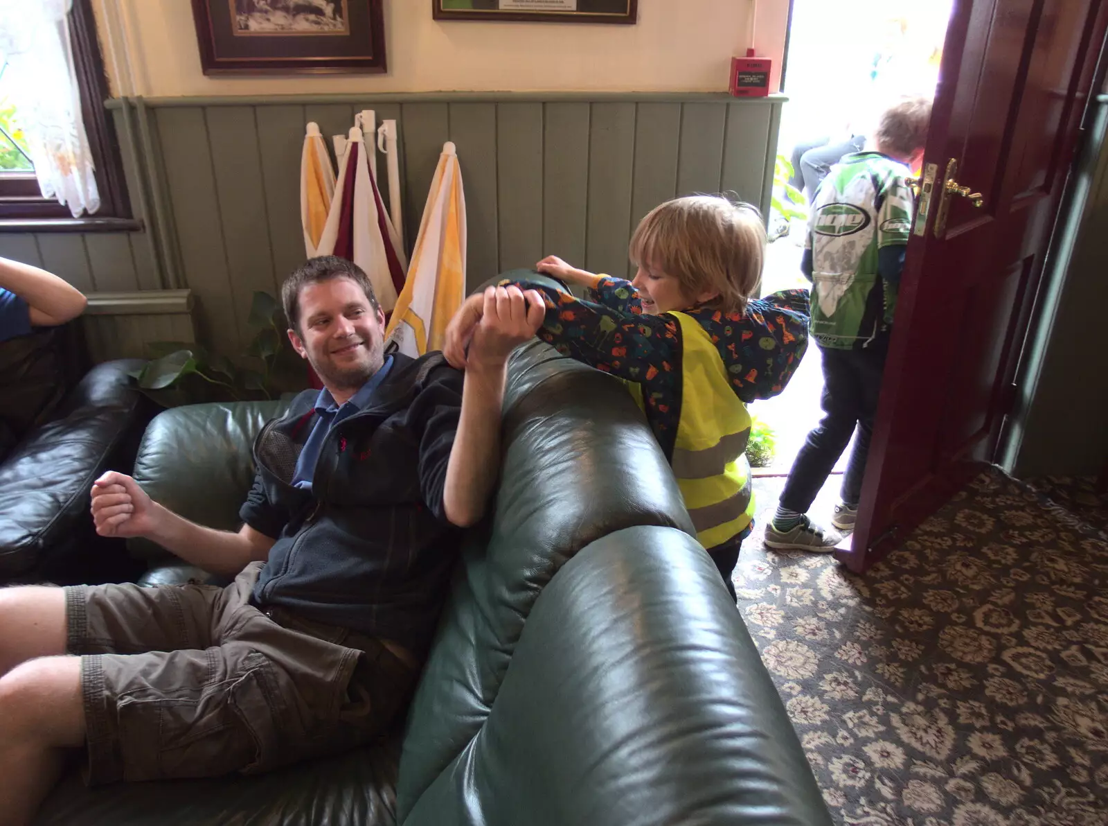 Phil and Harry wrestle on the sofa, from The Last-Ever BSCC Weekend Away Bike Ride, Thaxted, Essex - 6th May 2017