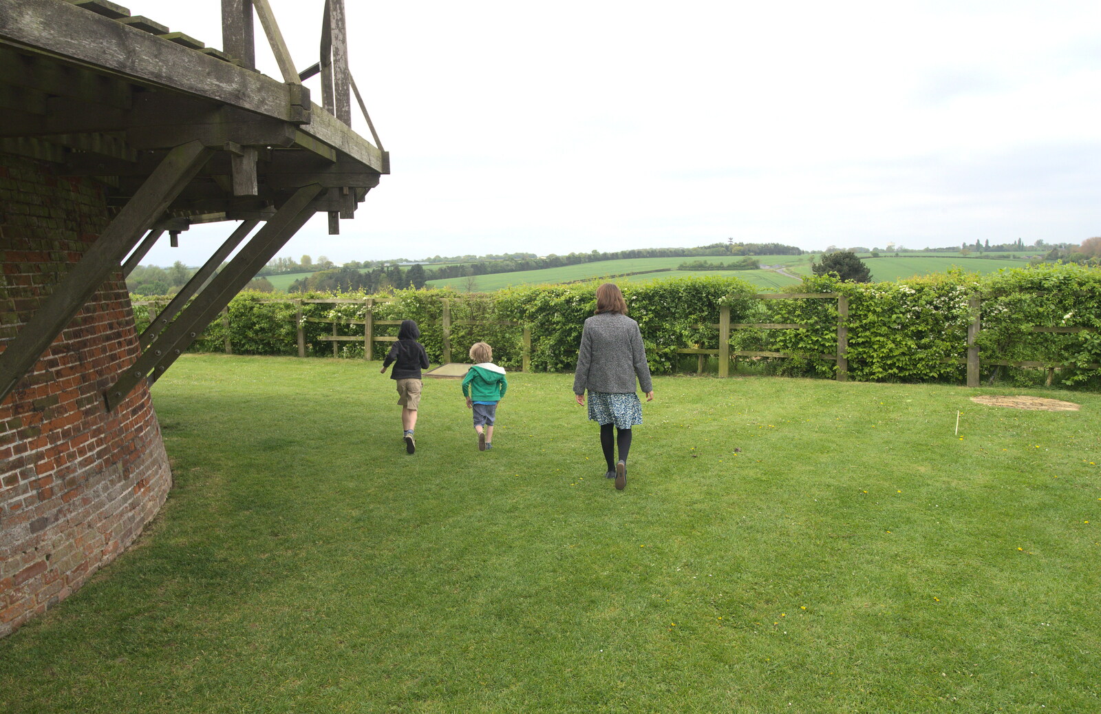 The boys run around the windmill from A Postcard From Thaxted, Essex - 7th May 2017