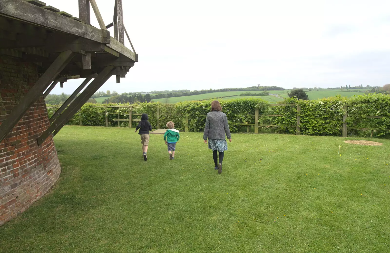 The boys run around the windmill, from A Postcard From Thaxted, Essex - 7th May 2017