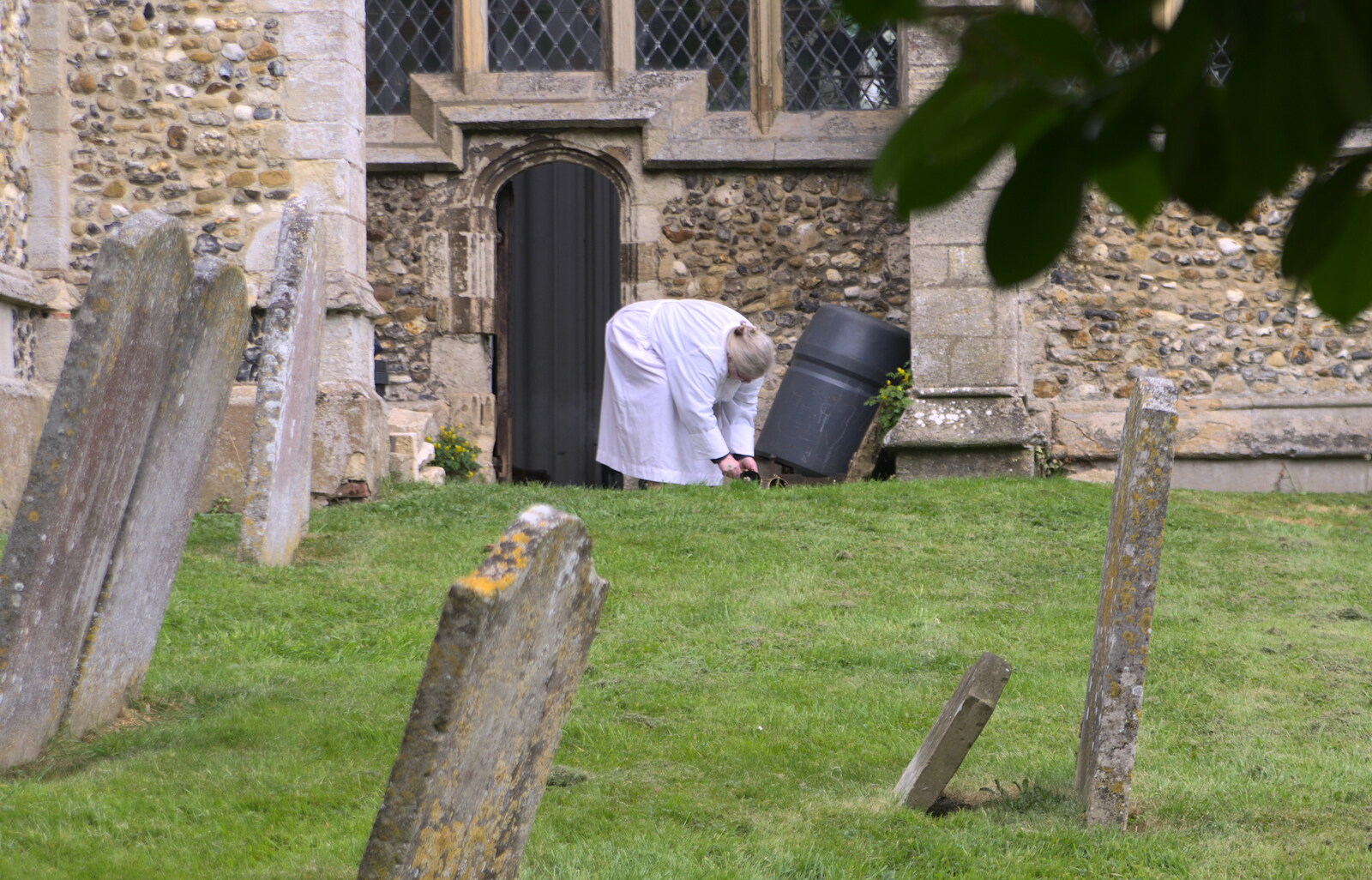 The vicar puts out the incense on the grass from A Postcard From Thaxted, Essex - 7th May 2017