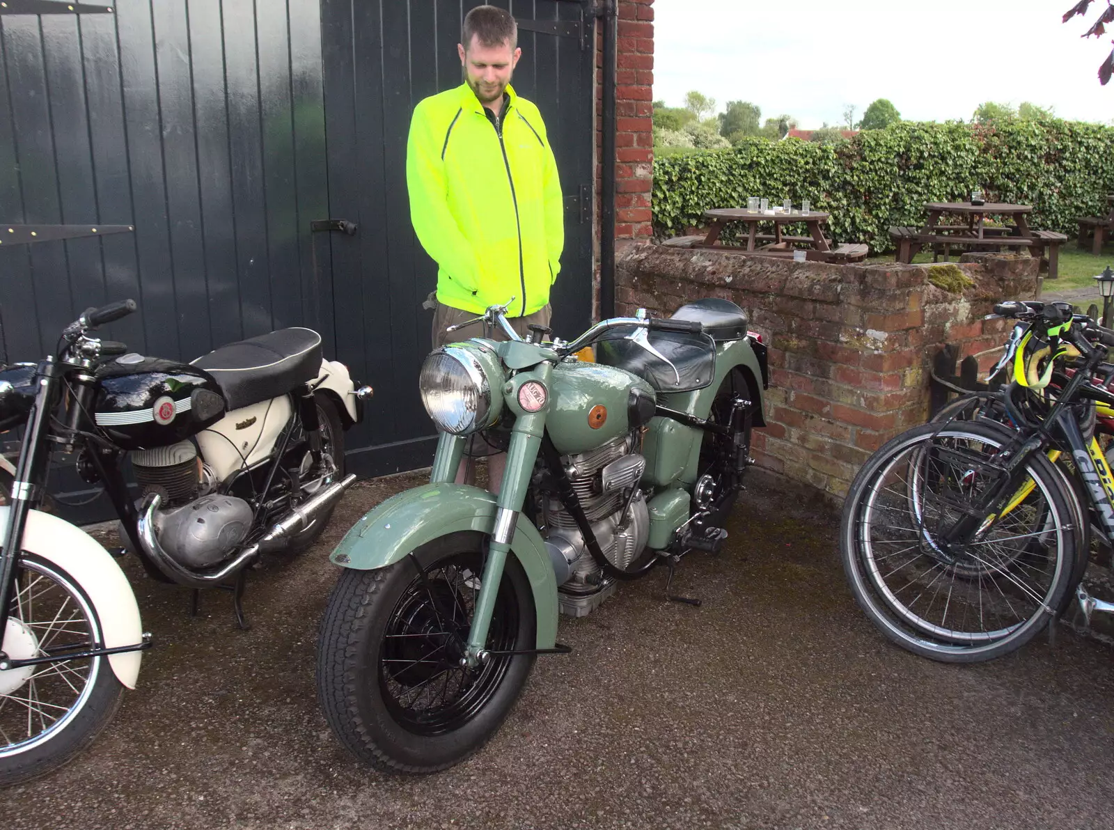 Phil inspects a motorbike at the Wortwell Bell, from A Day at the Grain Brewery Open Day, Alburgh, Suffolk - 20th May 2017