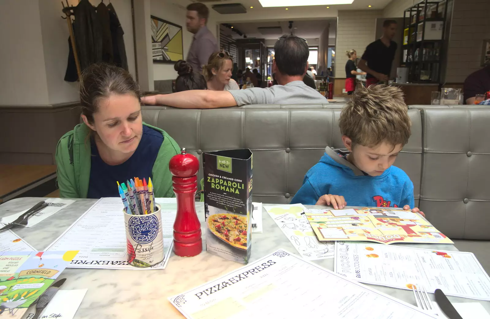 Isobel and Fred scope the menu in Pizza Express, from Wavy and Martina's Combined Birthdays, Thrandeston, Suffolk - 27th May 2017