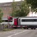 A train thunders through the crossing, The BSCC at the Mellis Railway and The Swan, Brome, Suffolk - 8th June 2017