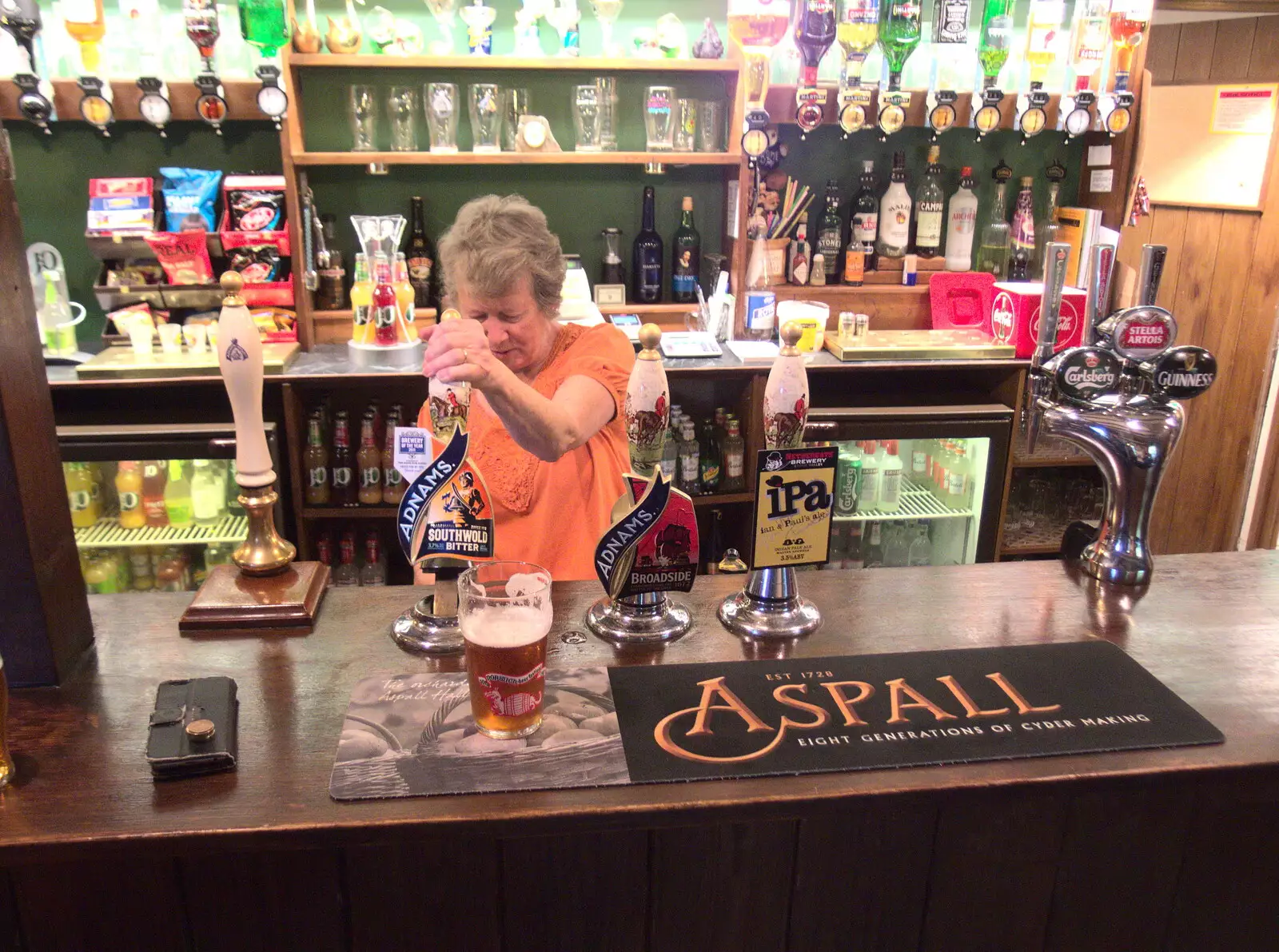 Sylvia pulls a pint, from The BSCC at the Mellis Railway and The Swan, Brome, Suffolk - 8th June 2017