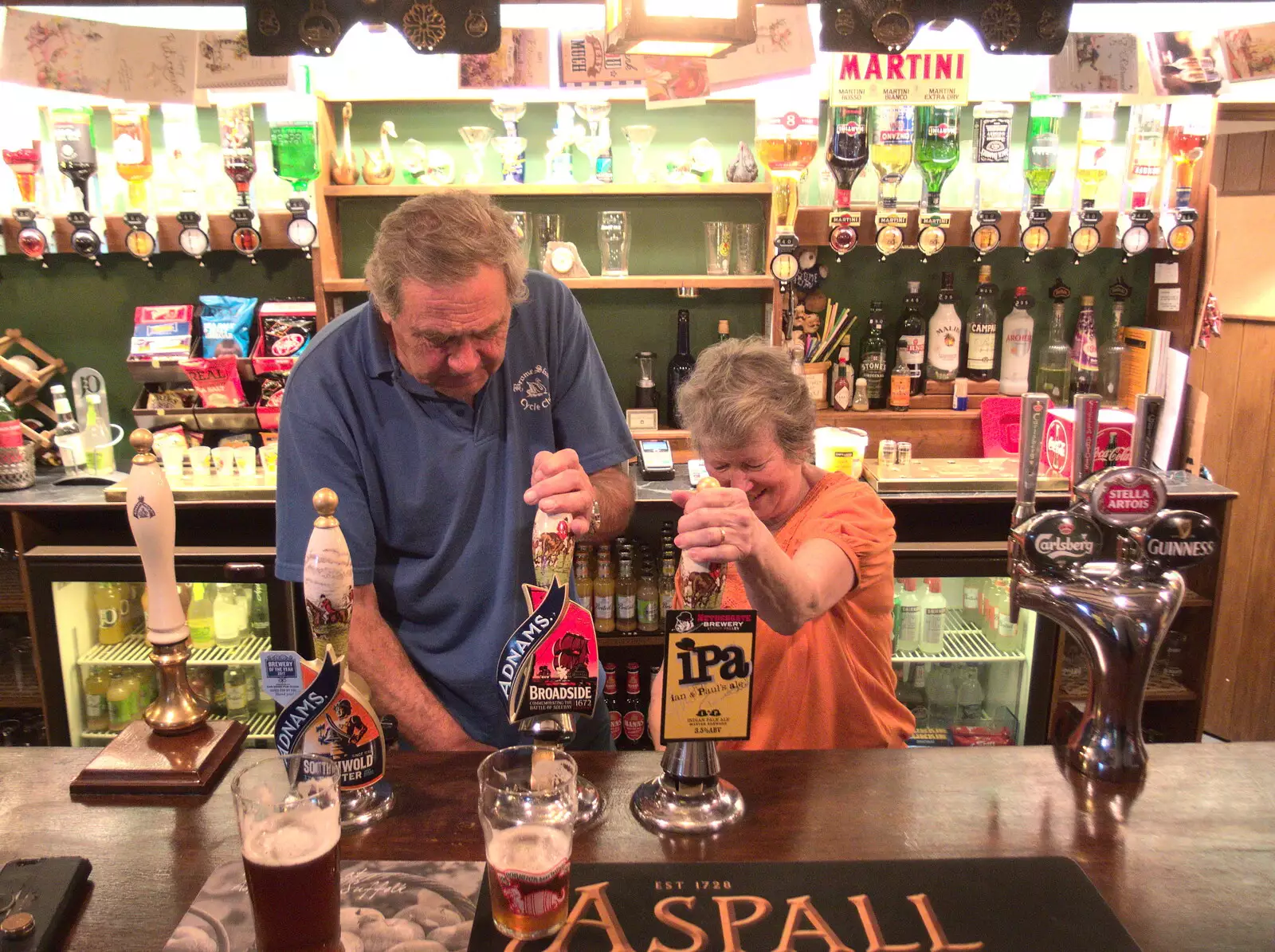 Alan and Sylvia pull pints, from The BSCC at the Mellis Railway and The Swan, Brome, Suffolk - 8th June 2017