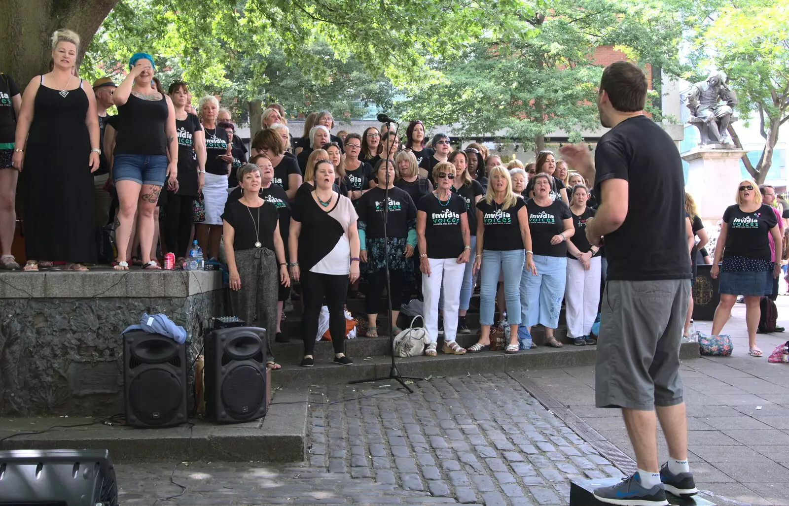 The choir continues singing, from Isobel's Choral Flash Mob, Norwich, Norfolk - 17th June 2017