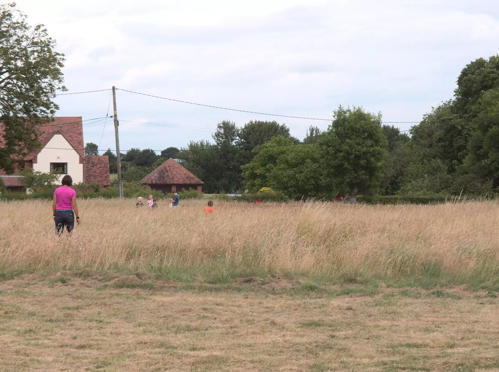 The children run off into the long grass, from Thrandeston Pig, Little Green, Thrandeston, Suffolk - 25th June 2017