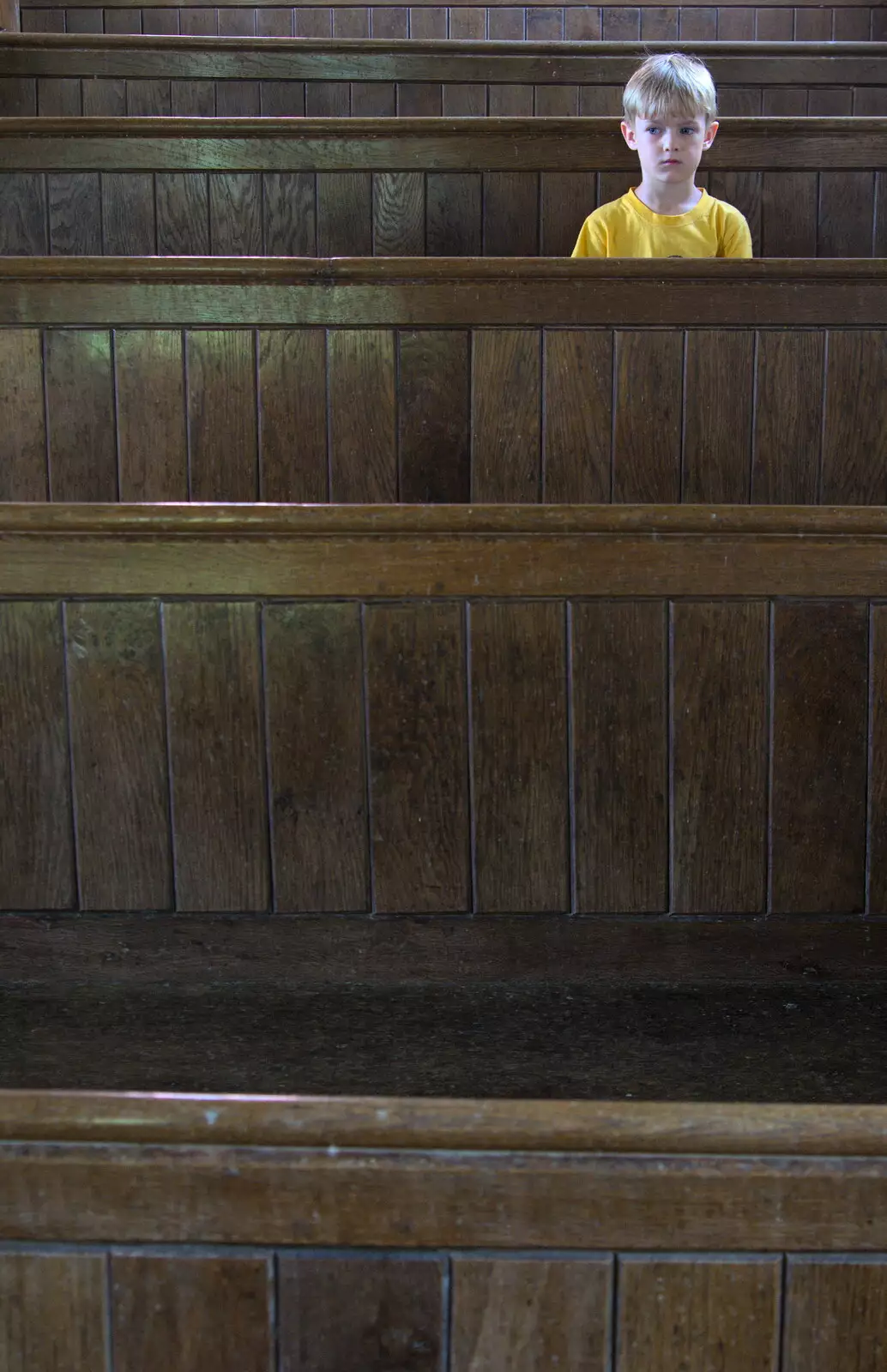 Harry sits in the pews, from Camping at Dower House, West Harling, Norfolk - 1st July 2017