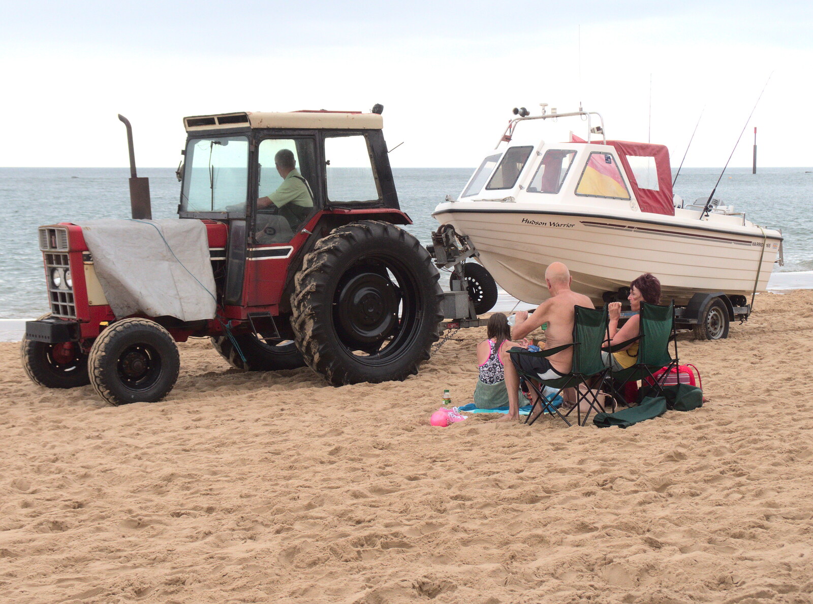 Optimistic sunbathers and a tractor towing a boat from A Wet Day at the Beach, Sea Palling, Norfolk - 16th July 2017