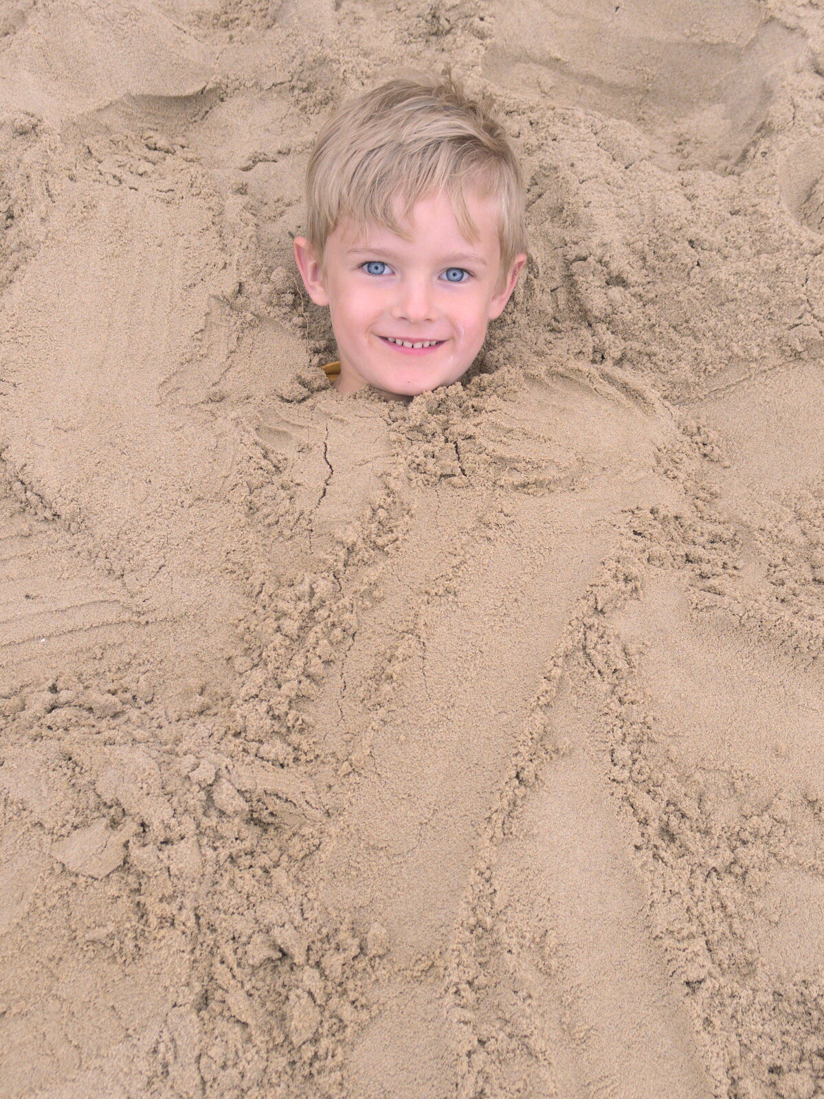 Harry's buried in sand from A Wet Day at the Beach, Sea Palling, Norfolk - 16th July 2017