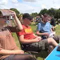 Suey uses the beer list as a sun shade, The Humpty Dumpty Beer Festival, Reedham, Norfolk - 22nd July 2017