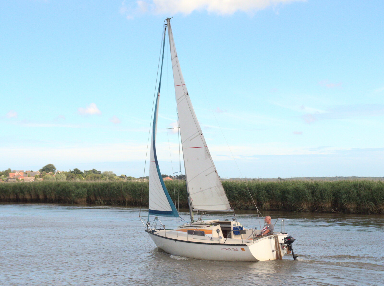 A yacht heads down wind from The Humpty Dumpty Beer Festival, Reedham, Norfolk - 22nd July 2017