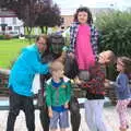 Harryanna's mum hangs on a statue of John Egan, In The Sneem, An tSnaidhm, Kerry, Ireland - 1st August 2017