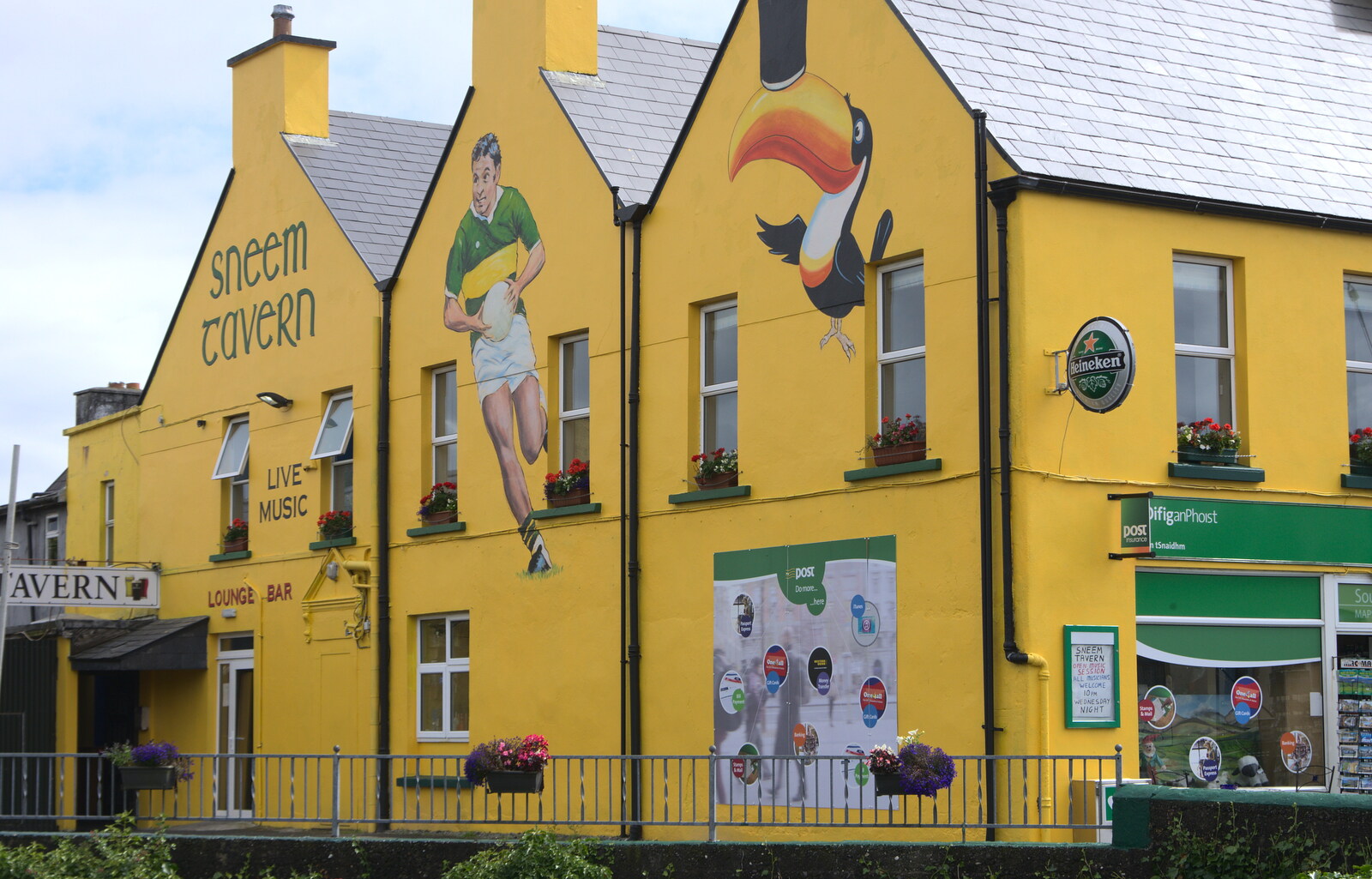 Guinness ads and GAA paintings on the Sneem Tavern from In The Sneem, An tSnaidhm, Kerry, Ireland - 1st August 2017