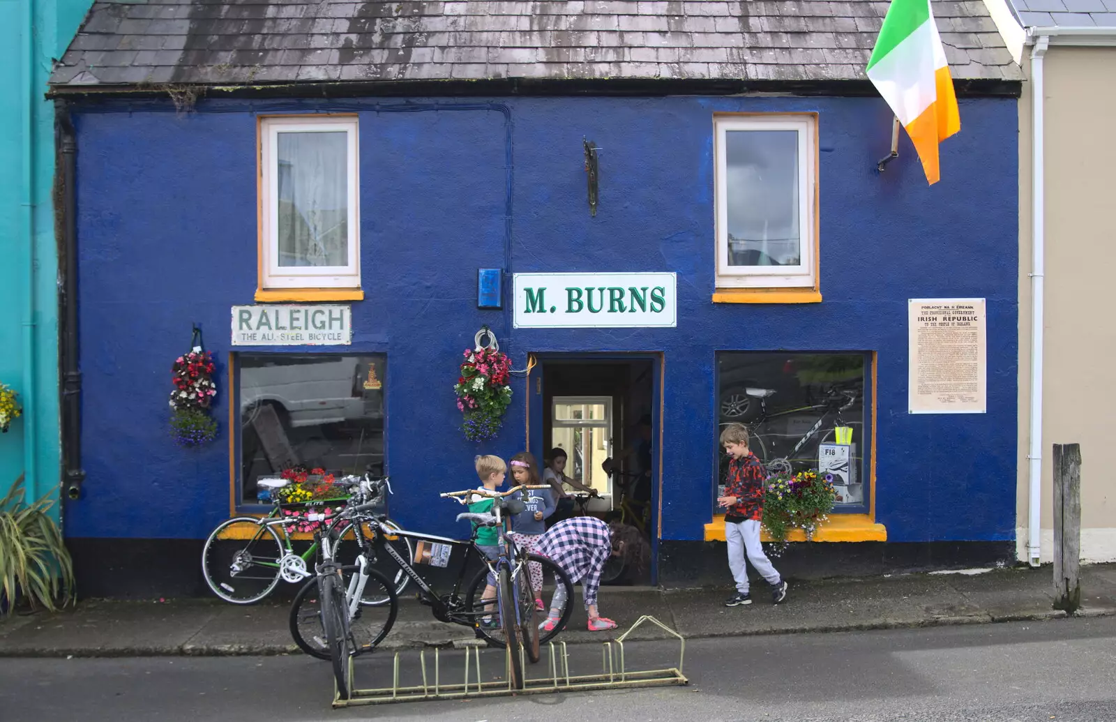 The gang outside M Burns's bike shop in Sneem, from In The Sneem, An tSnaidhm, Kerry, Ireland - 1st August 2017