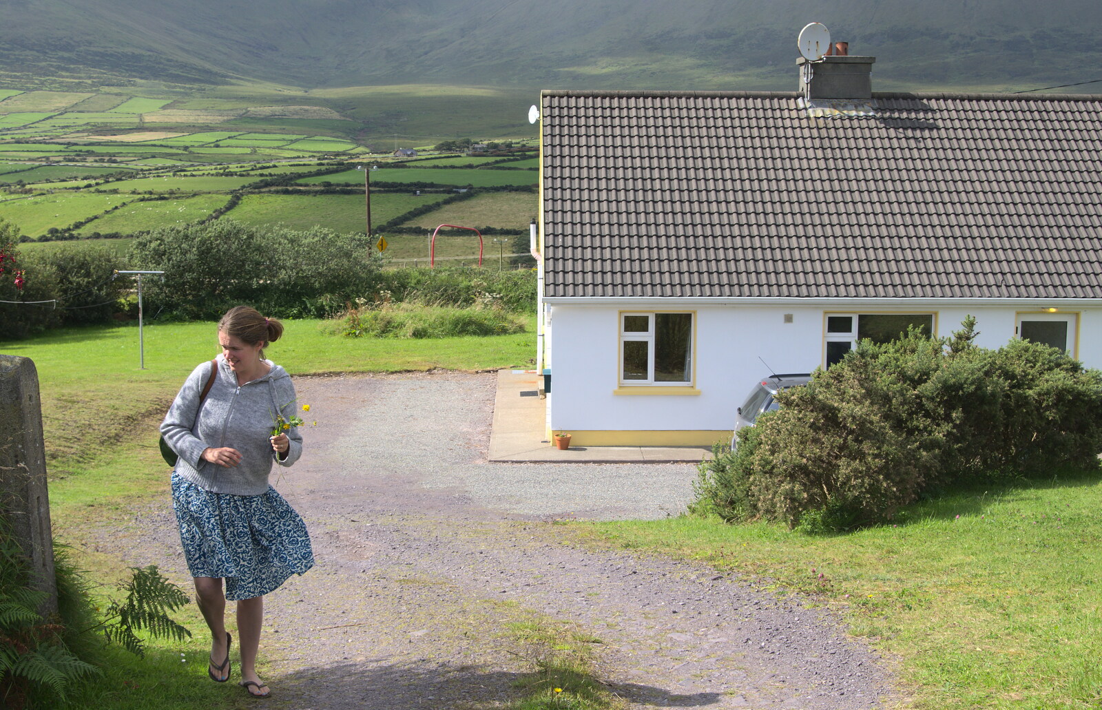 Isobel walks up the drive with a flower from The Annascaul 10k Run, Abha na Scáil, Kerry, Ireland - 5th August 2017