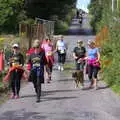 Walkers and people with dogs head down to the finish, The Annascaul 10k Run, Abha na Scáil, Kerry, Ireland - 5th August 2017