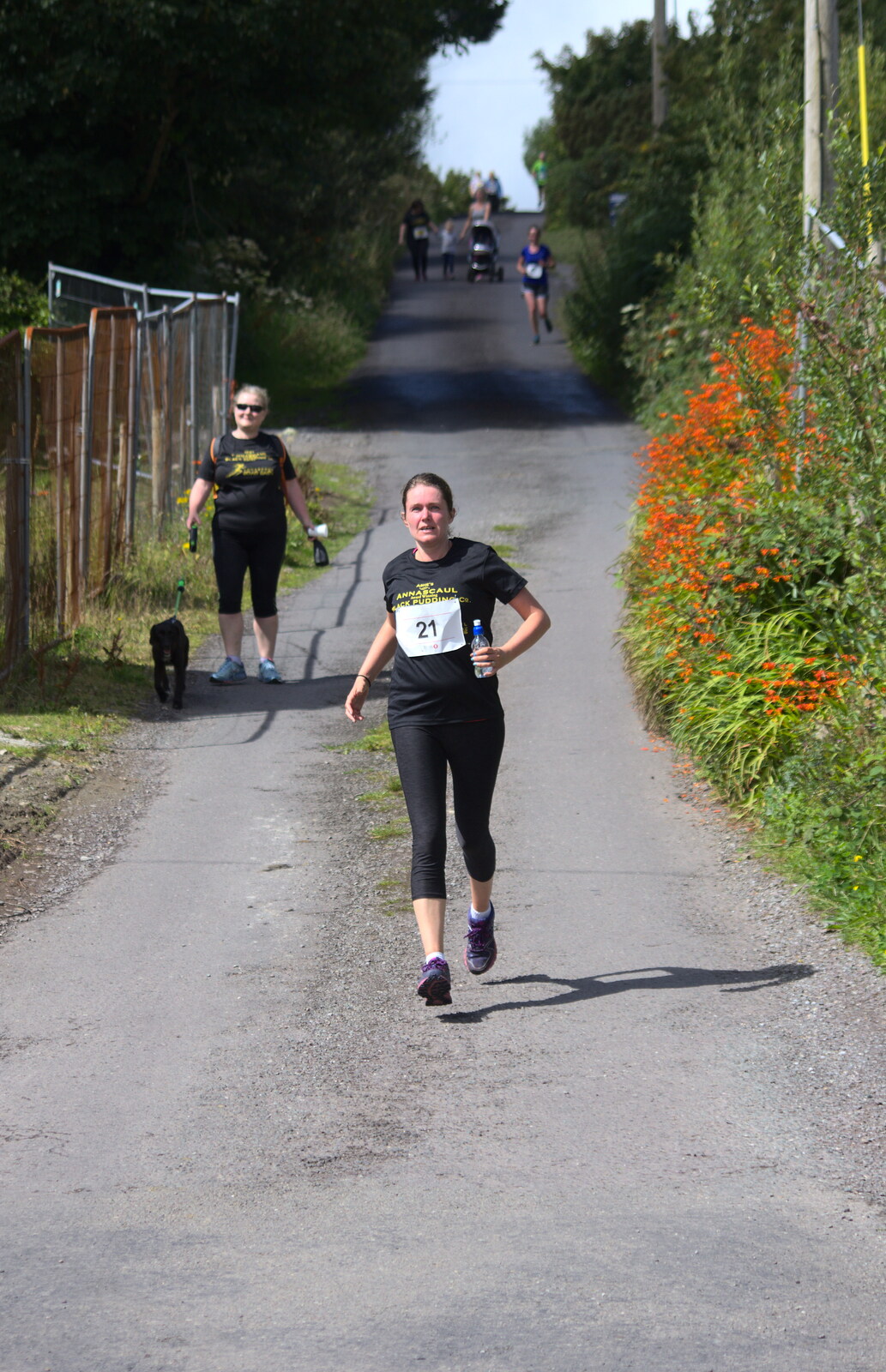 Isobel comes in on the final straight from The Annascaul 10k Run, Abha na Scáil, Kerry, Ireland - 5th August 2017