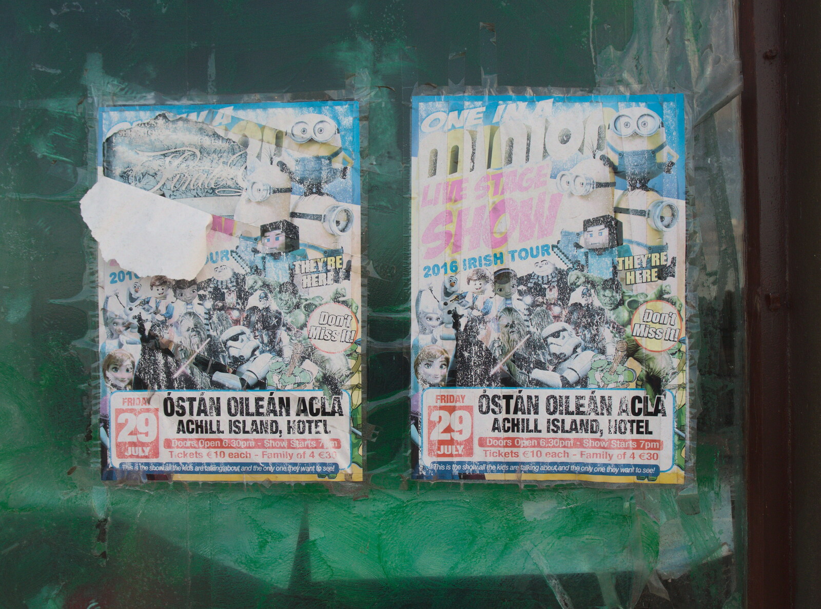 Old posters stuck up in a window from Surfing Achill Island, Oileán Acla, Maigh Eo, Ireland - 8th August 2017