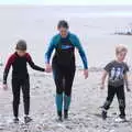 Isobel and Fred walk up the beach with Harry, Surfing Achill Island, Oileán Acla, Maigh Eo, Ireland - 8th August 2017