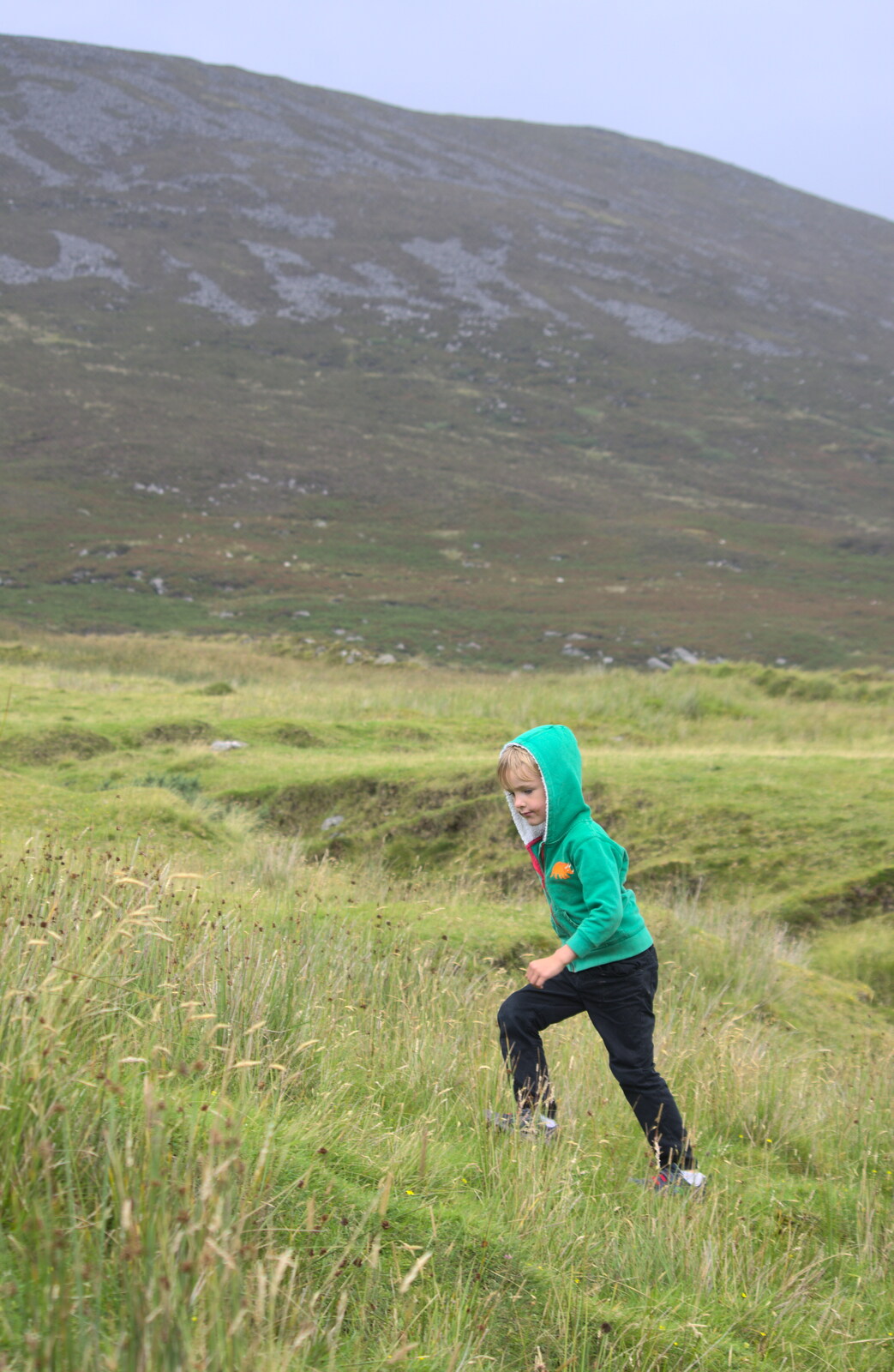 Harry runs up a hill from Surfing Achill Island, Oileán Acla, Maigh Eo, Ireland - 8th August 2017