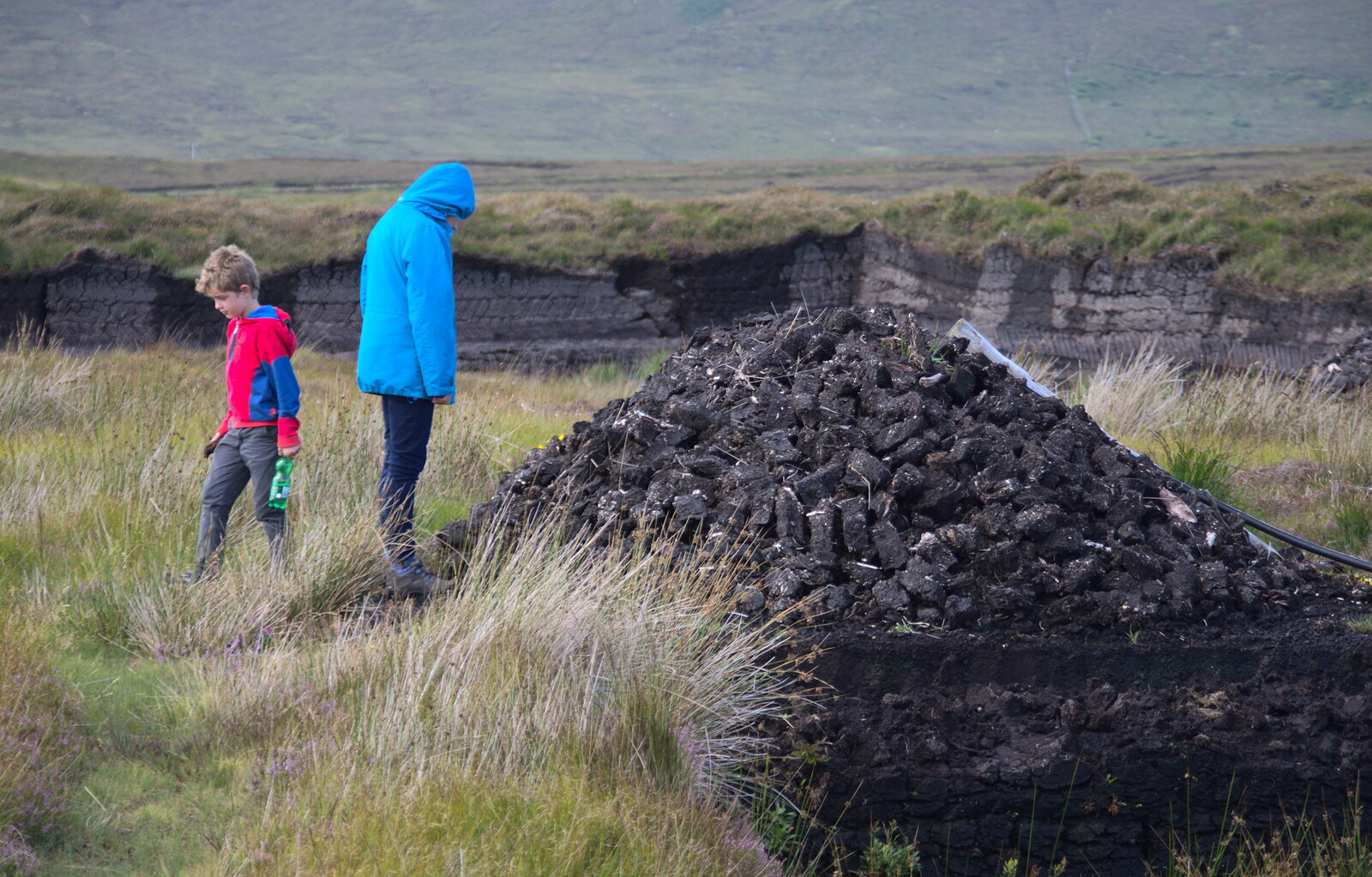 Isobel looks down on a big mound of peat from Surfing Achill Island, Oileán Acla, Maigh Eo, Ireland - 8th August 2017