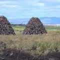 Three mounds of peat briquettes, Surfing Achill Island, Oileán Acla, Maigh Eo, Ireland - 8th August 2017