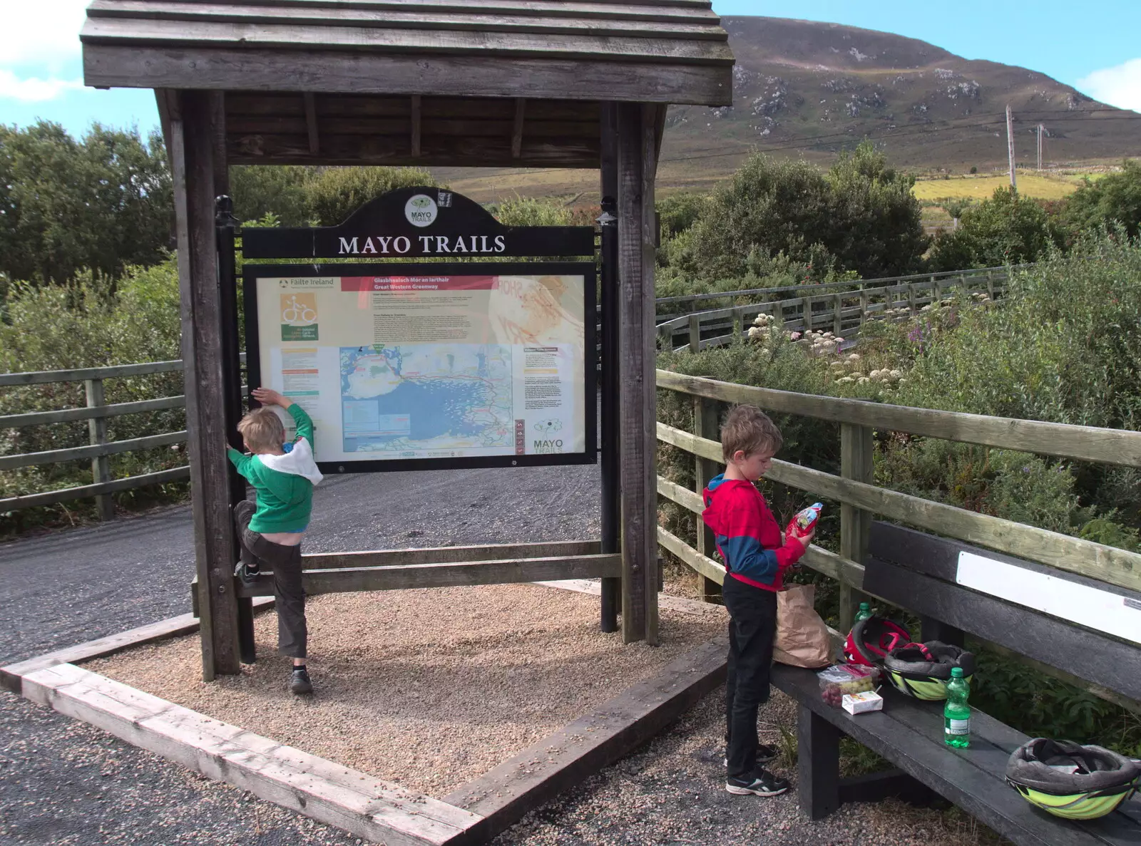 Harry tries to climb the sign, from A Bike Ride to Mulranny, County Mayo, Ireland - 9th August 2017