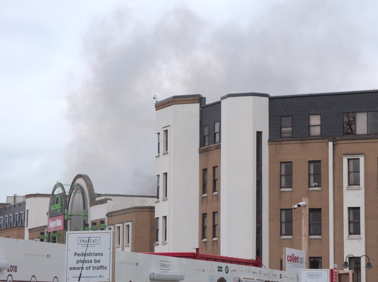 More smoke piles off the roof from Fire and Water: The Burning of the Blackrock Centre, County Dublin, Ireland - 12th August 2017